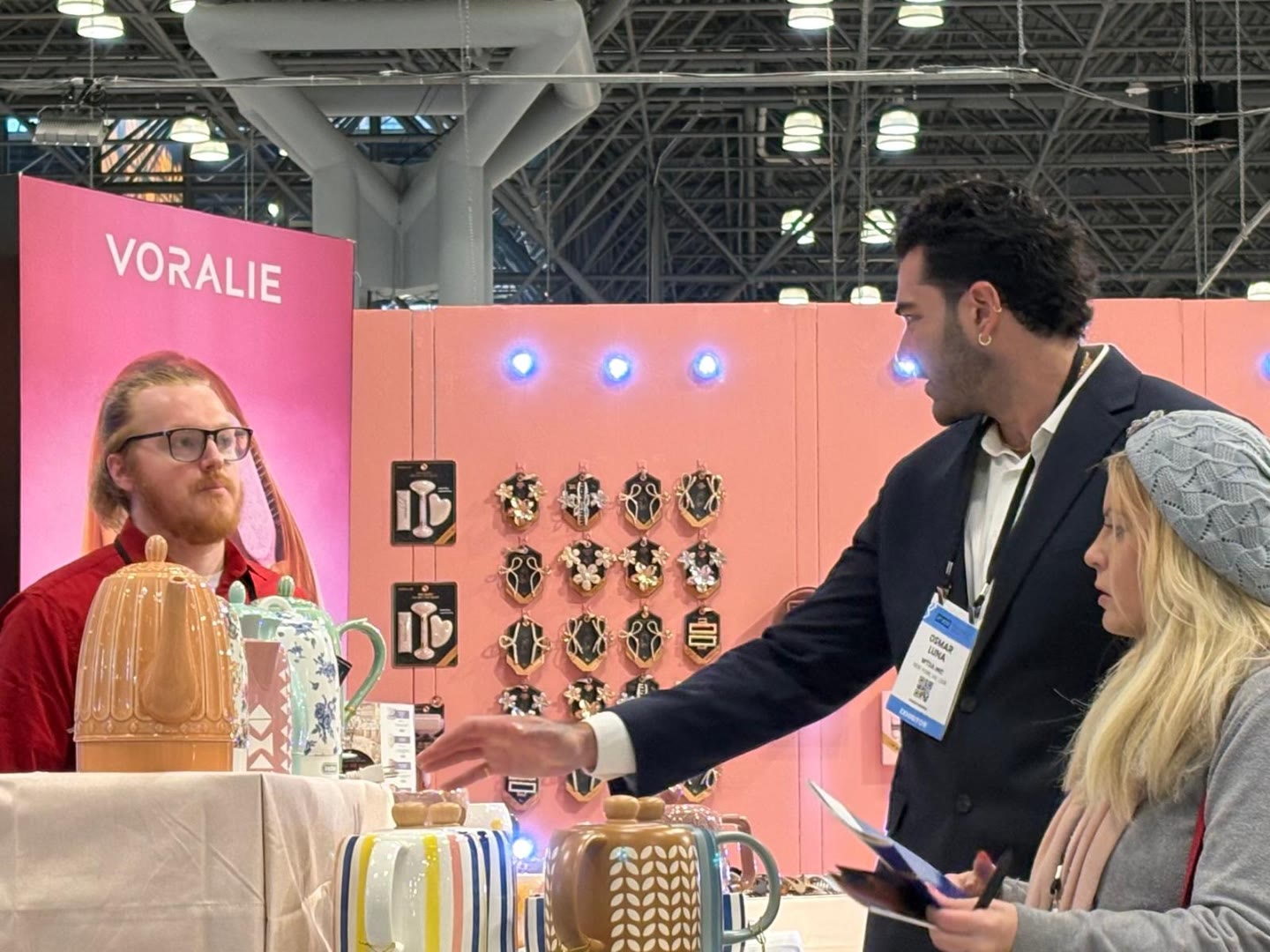 Aqualora team engaging buyer at Voralie wall